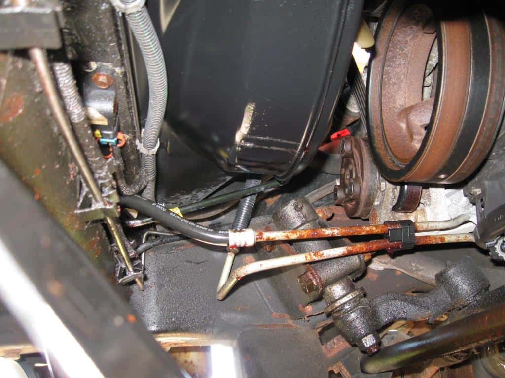 transmission cooler lines on Chevy Silverado covered in rust